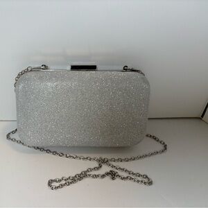 Silver glitter clutch bag with removable chain strap by Jessica McClintock